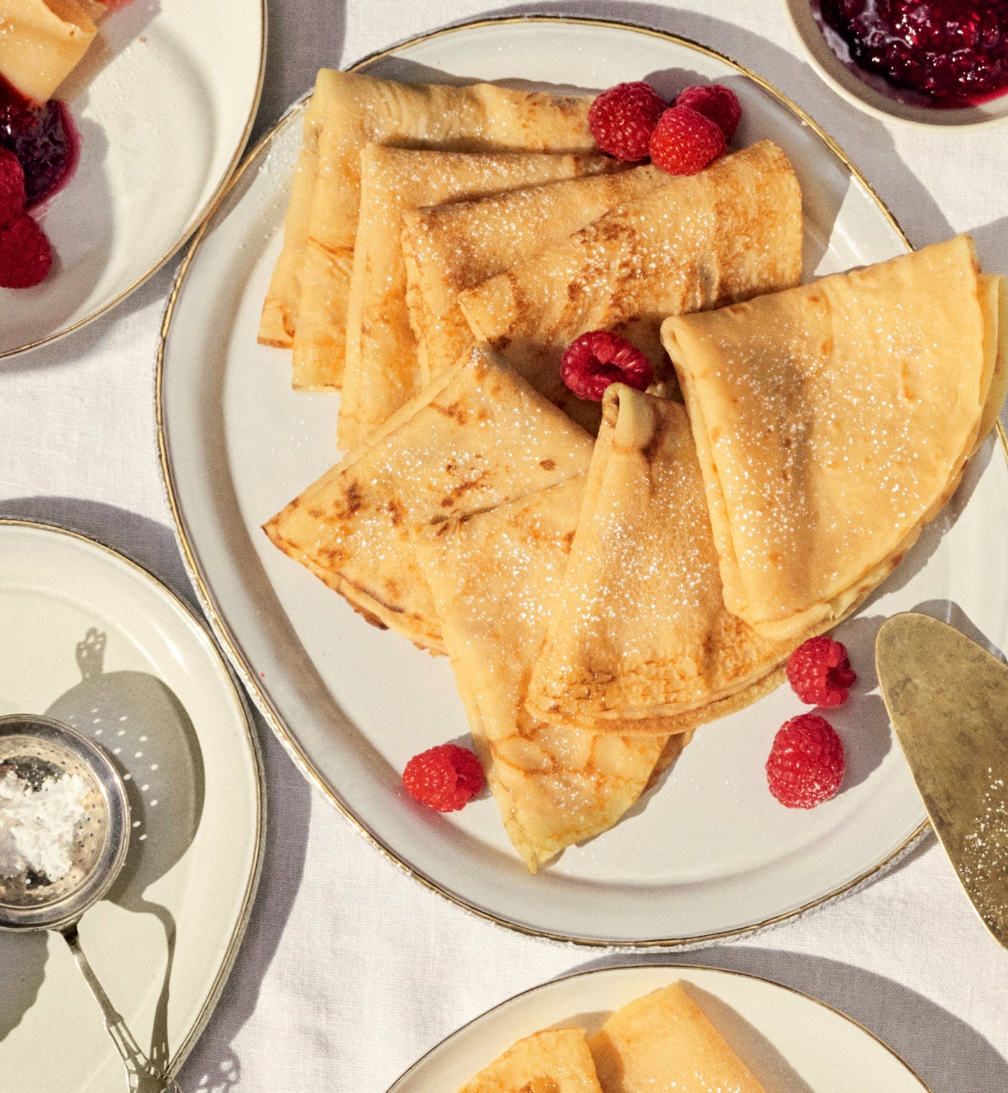 Crepes on a plate with raspberries