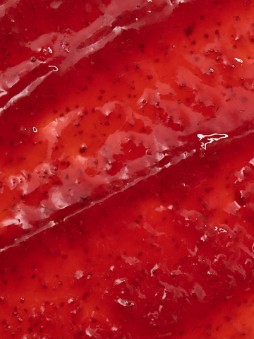 Close-up of a red strawberry spread with visible seeds