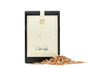 A black, beige, and gold package of mulling spice with loose spice in front of it. 