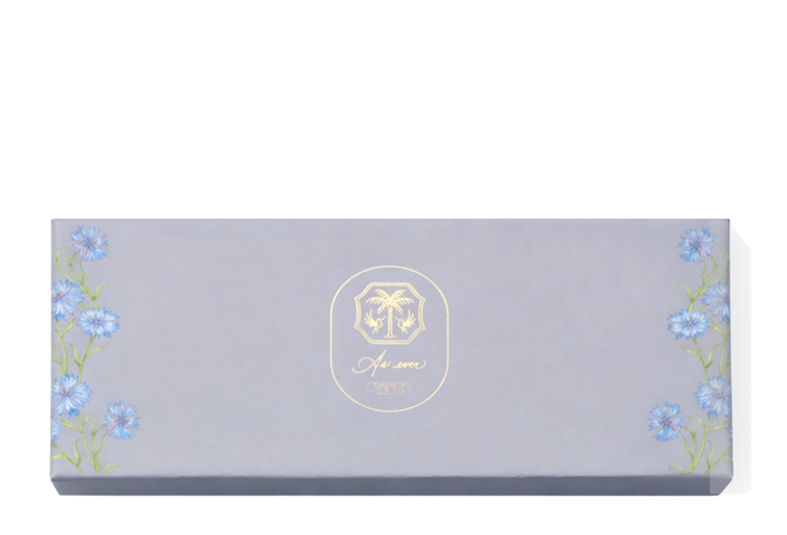 A blue chocolate box with blue flowers with green stems climbing the outside edges. A gold As ever logo is in the centre of the box. 
