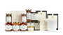 A variety of pantry products including candles, teas, honey, edible flower sprinkles, and jams and honeys. 