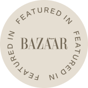 Round beige sticker with 'Featured in Harper's Bazaar' text