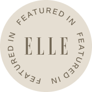 Circular badge with 'ELLE' branding on a white background