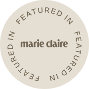 Circular sticker with 'Featured in Marie Claire' text on a white background