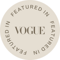 Round beige badge with 'Vogue' text on a white background