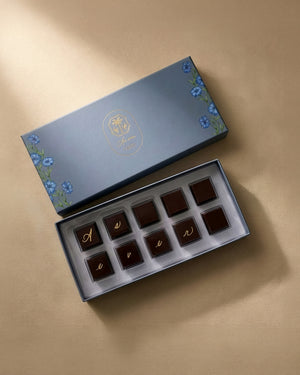 A box of chocolates on a surface. 